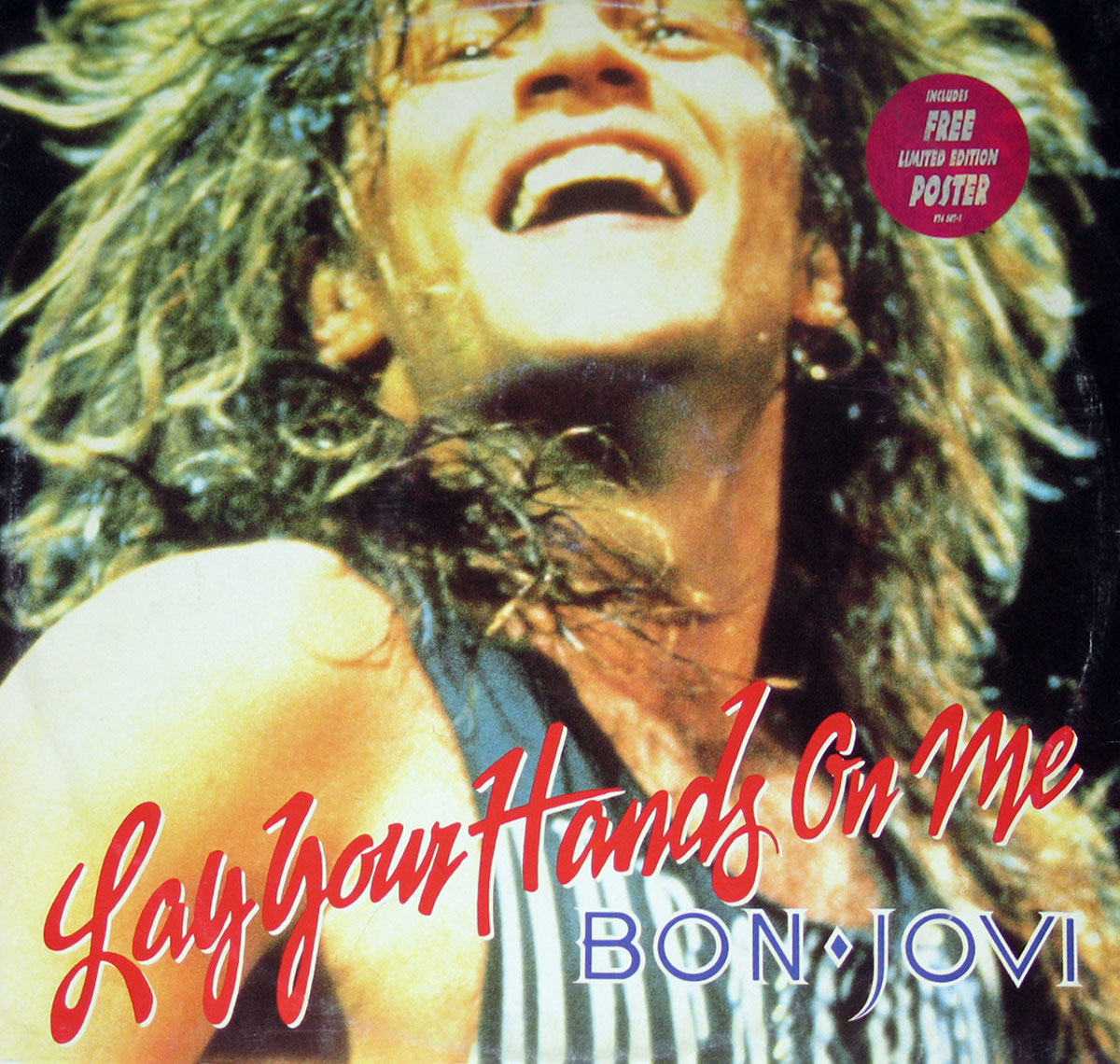 Front cover of Bon Jovi’s 1989 Lay Your Hands On Me 12-inch vinyl EP album including poster. The artwork shows a dramatic, high-contrast photographic design with vibrant colors and bold typography, emphasizing the band’s stadium rock energy and late-1980s aesthetic. The layout captures the intensity and excitement of Bon Jovi’s music during this peak era.