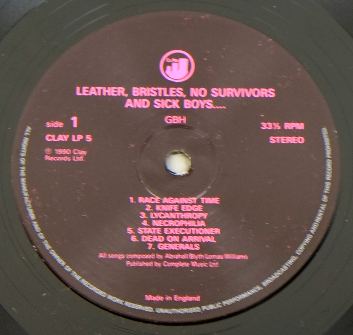 Close up of record's label CHARGED G.B.H. -  Leather Bristles No Survivors And Sick Boys 12" LP Vinyl Album Side One