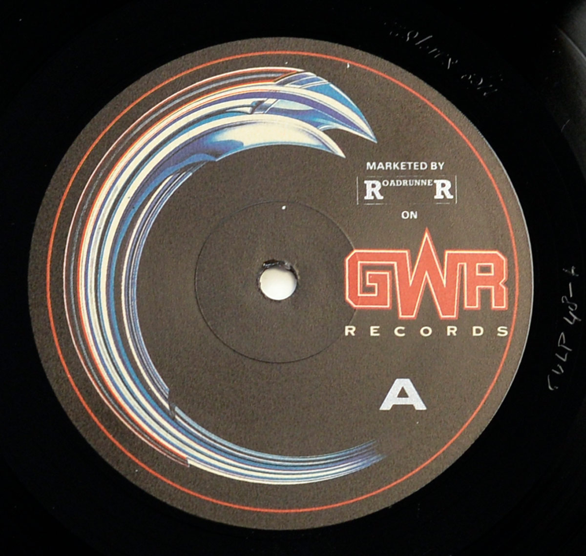 SGM Aggression 12 inch vinyl LP, Side A label. Features GWR Records logo, distributed by Roadrunner, bold concentric swirl artwork in blue and red, and matrix etching.