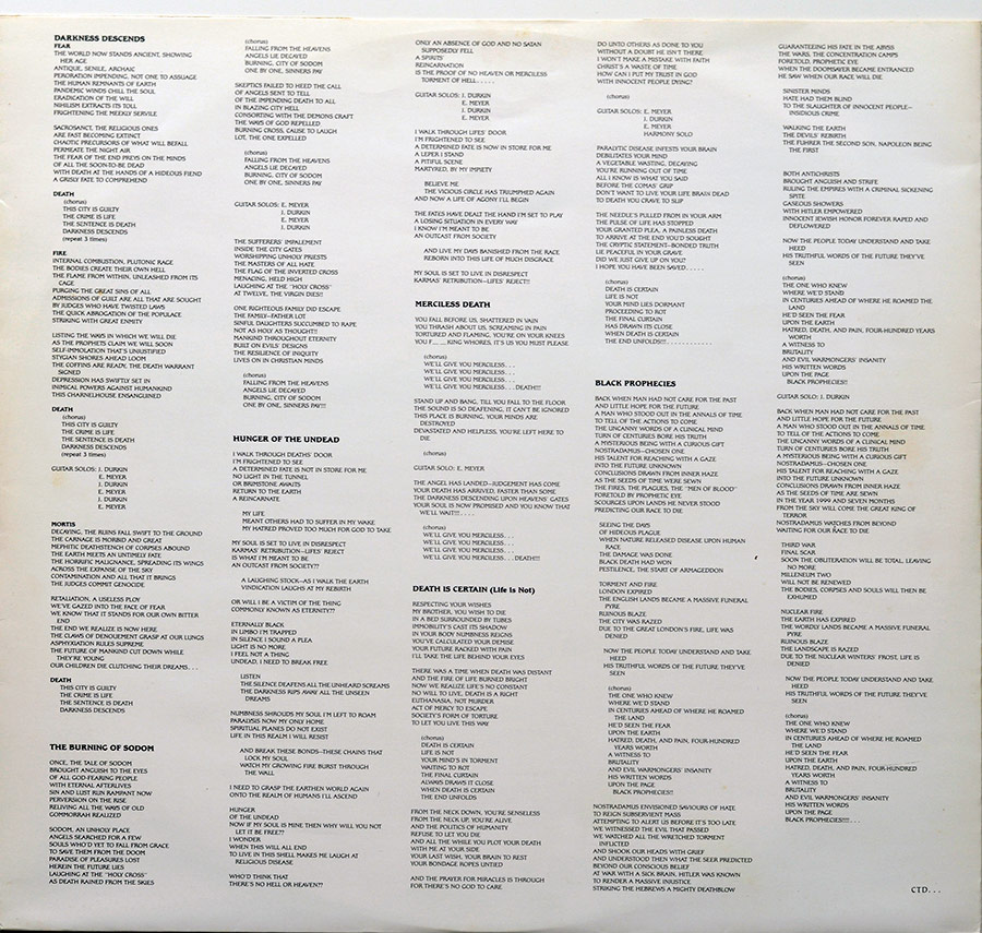 Lyrics of all the songs on "Darkness Descends" printed on the album's original custom inner sleeve 
