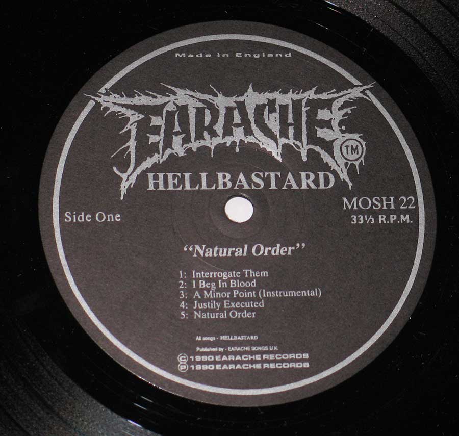 Close up of record's label HELLBASTARD - NATURAL ORDER 12" VINYL LP ALBUM Side One