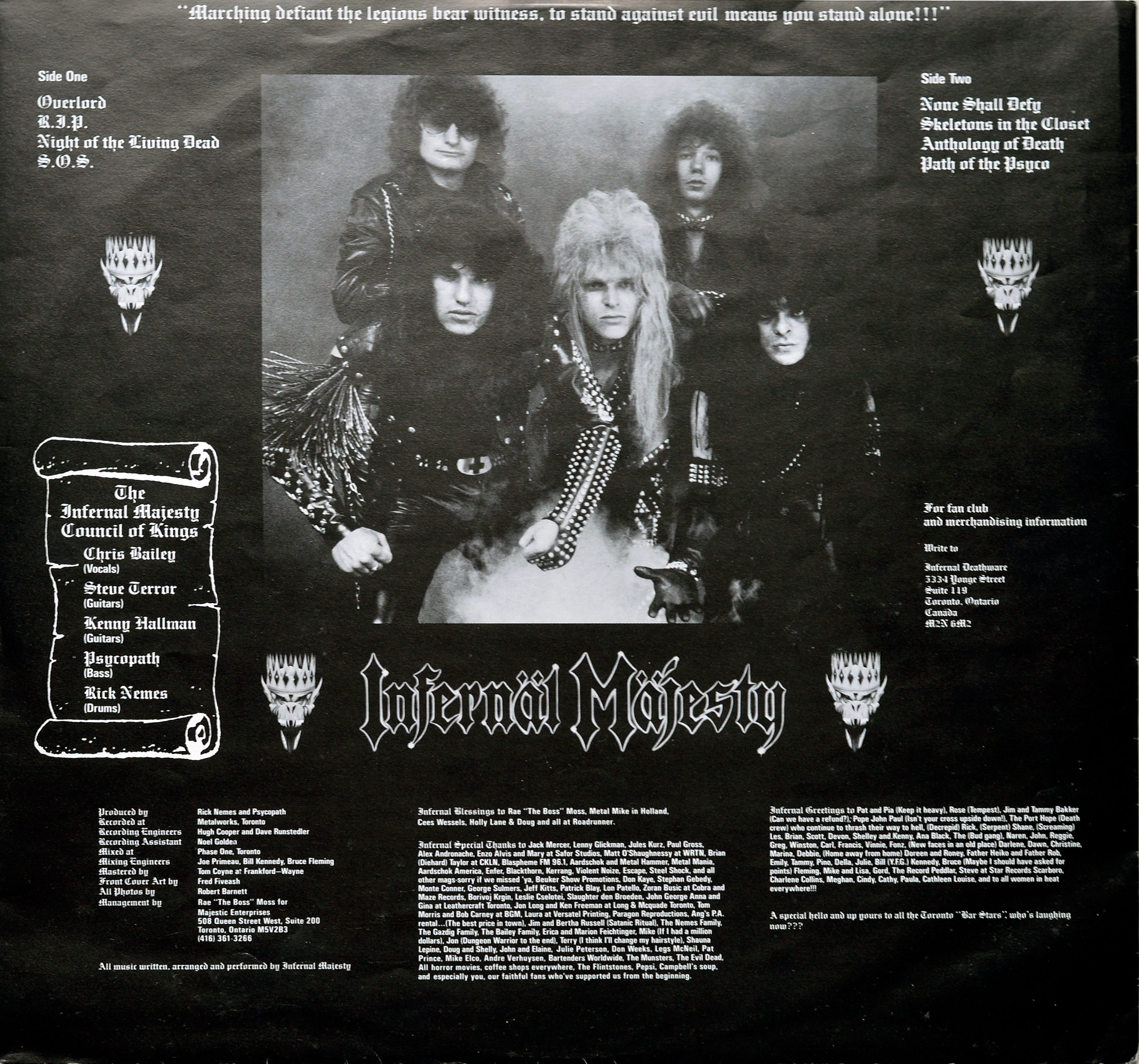 Black and white photo of Canadian thrash metal band Infernal Majesty on a custom inner sleeve. The five band members pose in studded leather jackets, spikes, and chains, with teased long hair. The central figure, likely vocalist Chris Bailey, has prominent platinum blond hair and an intense expression. Other members surround him with dark, grim looks, one wearing heavy studded shoulder armor. The high-contrast lighting and dark backdrop emphasize the band’s aggressive, rebellious thrash metal aesthetic https://vinyl-records.nl 