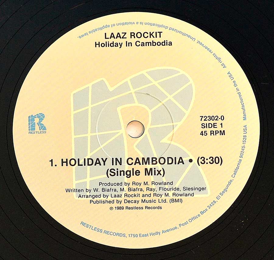 Photo of "LAAZ ROCKIT - Holiday in Cambodja" 12" Record Label - Side One: