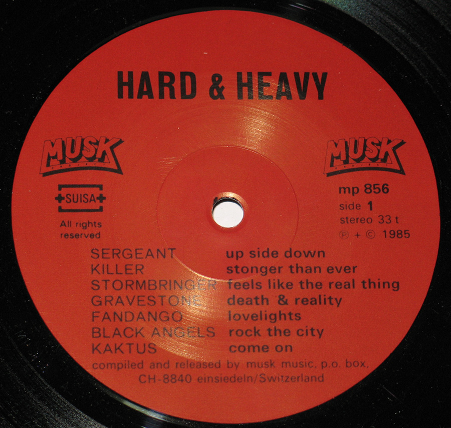 Close up of record's label HARD & HEAVY MUSK Swiss Hard Rock and Heavy Metal 12" VInyl LP album Side One